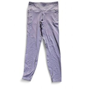 Under Armour purple activewear leggings w pockets Size M
